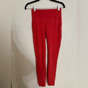 Vuori Women's Orange stride ziper pocket Leggings size XS